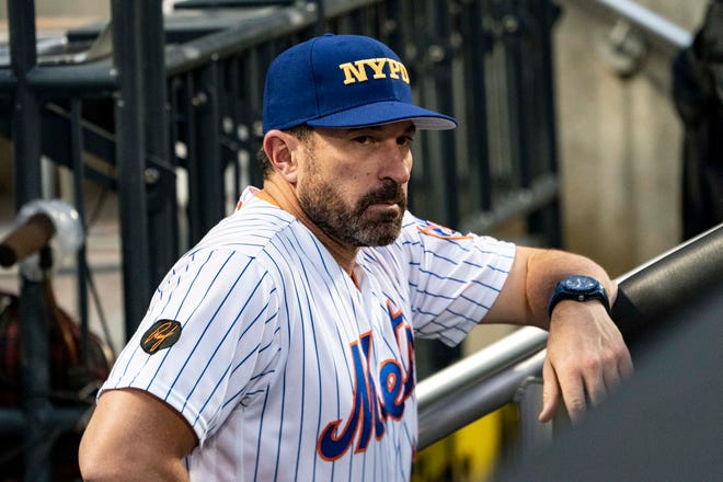 Sep 11, 2018; New York City, NY, USA; New York Mets manager Mickey Callaway (36) wears a NYPD cap to honor  and remember September 11, 2001 during the first inning of the game at Citi Field.
