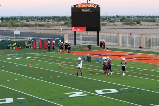 OUAZ players practice on new football field on Tuesday night in Surprise on Sept. 11, 2018.