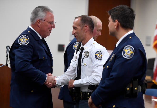 York County Sheriff Richard Keuerleber, left, recognizes Deputy Shane Kauffman and Sgt. Justin Koller with the Distinguished Public Service Award during the annual Promotion and Award Ceremony, Wednesday, Sept. 12, 2018.  Deputy Kauffman and Sgt. Koller were honored for providing medical care to a gunshot patient and assisting York City Police in the search for the suspect. John A. Pavoncello photo