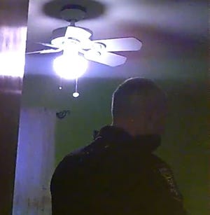In this capture from body camera footage a police officer speaks with Heriberto Carrasquillo (out of frame). Footage courtesy Mallon & Tranger.