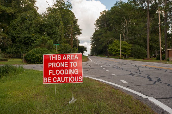 The sign says it all: Much of Kinston sits adjacent to the Neuse River, which in heavy rain bursts its banks and, in the past, has devastated the community.