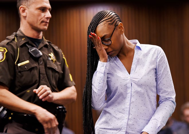 In this Sept. 12, 2018 photo, Samiya Speed wipes away a tear after reading her statement of sorrow and forgiveness to the family of construction worker David Snell in Detroit. Speed was sentenced to 46 months to 15 years in prison for the crash that killed Snell, a road construction worker.