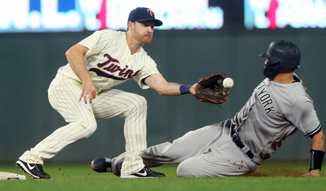 New York Yankees' Gary Sanchez beats the tag by Minnesota Twins second baseman Logan Forsythe to steal second base in the fifth inning of a baseball game Wednesday, Sept. 12, 2018, in Minneapolis.