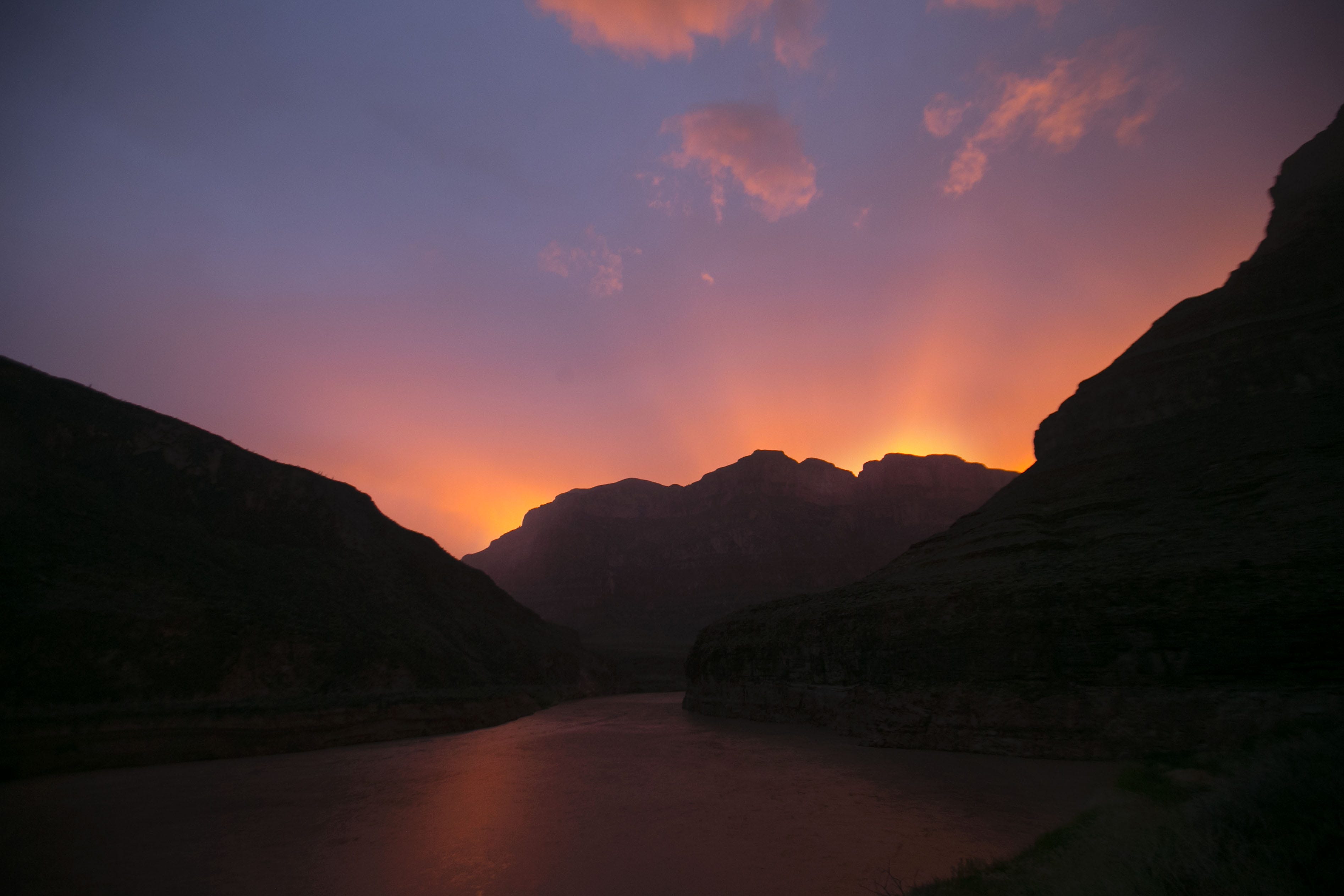 The sun sets over the Colorado River in the western part of Grand Canyon National Park.