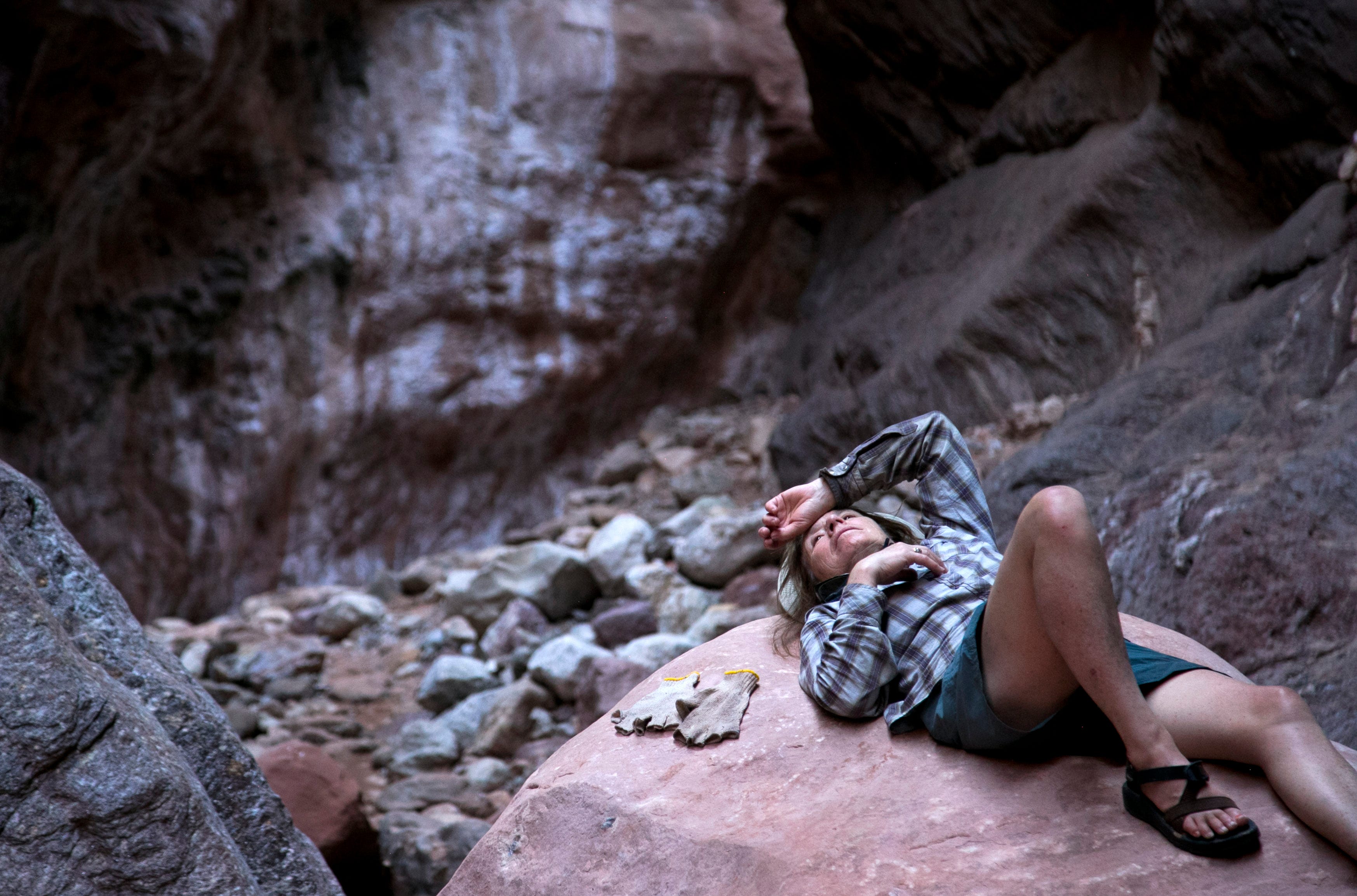 Suz Burd escapes the heat of the midday sun in Blacktail Canyon, a side canyon drainage of the Colorado River in Grand Canyon National Park on May 24, 2018. “I feel like I was born a generation too late and didn’t get to see it,” Burd says of the Canyon before the Glen Canyon Dam was built.