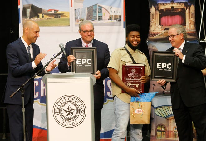 Recording artist and El Pasoan Khalid along with El Paso Mayor Dee Margo (second from left) and ElPaso Chamber President and CEO David M. Jerome gives Khalid some gifts from the chamber shortly after Mayor Margo presented Khalid with the Key to the City after delivering his first State of the City address.