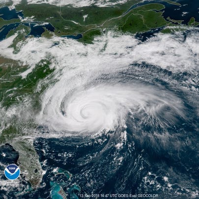 A satellite image shows Hurricane Florence spinning off the U.S. East Coast on Thursday, Sept. 13, 2018.