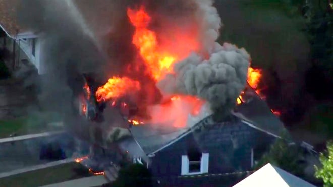 In this image take from video provided by WCVB in Boston, flames consume a home in Lawrence, Mass, a suburb of Boston, Thursday, Sept. 13, 2018. Emergency crews are responding to what they believe is a series of gas explosions that have damaged homes across three communities north of Boston. 