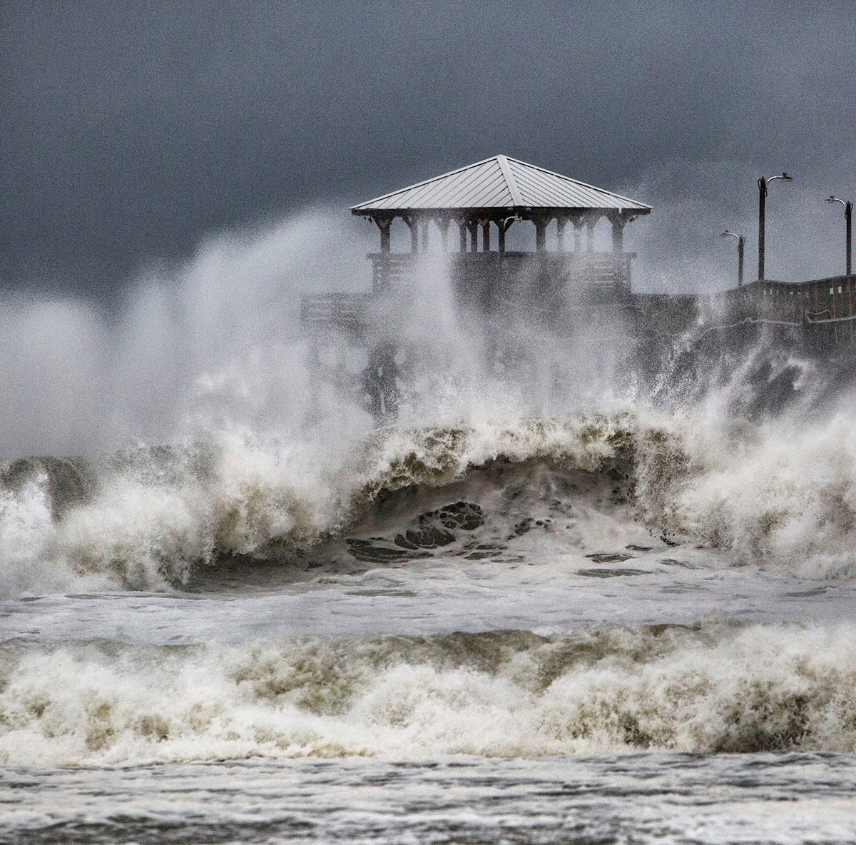 Waves slam the Oceana Pier & Pier House Restaurant in Atlantic Beach, N.C.,  Thursday, Sept. 13, 2018 as Hurricane Florence approaches the area.