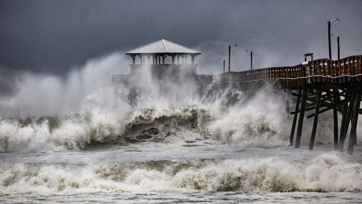 Waves slam the Oceana Pier & Pier House Restaurant in Atlantic Beach, N.C.,  Thursday, Sept. 13, 2018 as Hurricane Florence approaches the area.