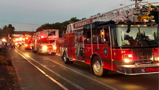 Multiple fire trucks from surrounding communities arrive Thursday, Sept. 13, 2018, in Lawrence, Mass., responding to a series of fires triggered by a problem with a gas line that feeds homes in several communities north of Boston. 