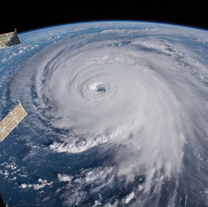 A handout photo made available by NASA early Thursday morning shows Hurricane Florence seen from a camera outside the International Space Station.