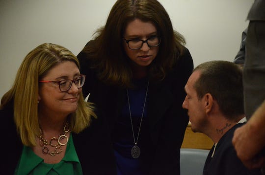 Attorneys Tracie Tomak, left, and Kimberly Wickham talk with Thomas Swarmes after a court hearing Friday, Sept. 14, 2018.