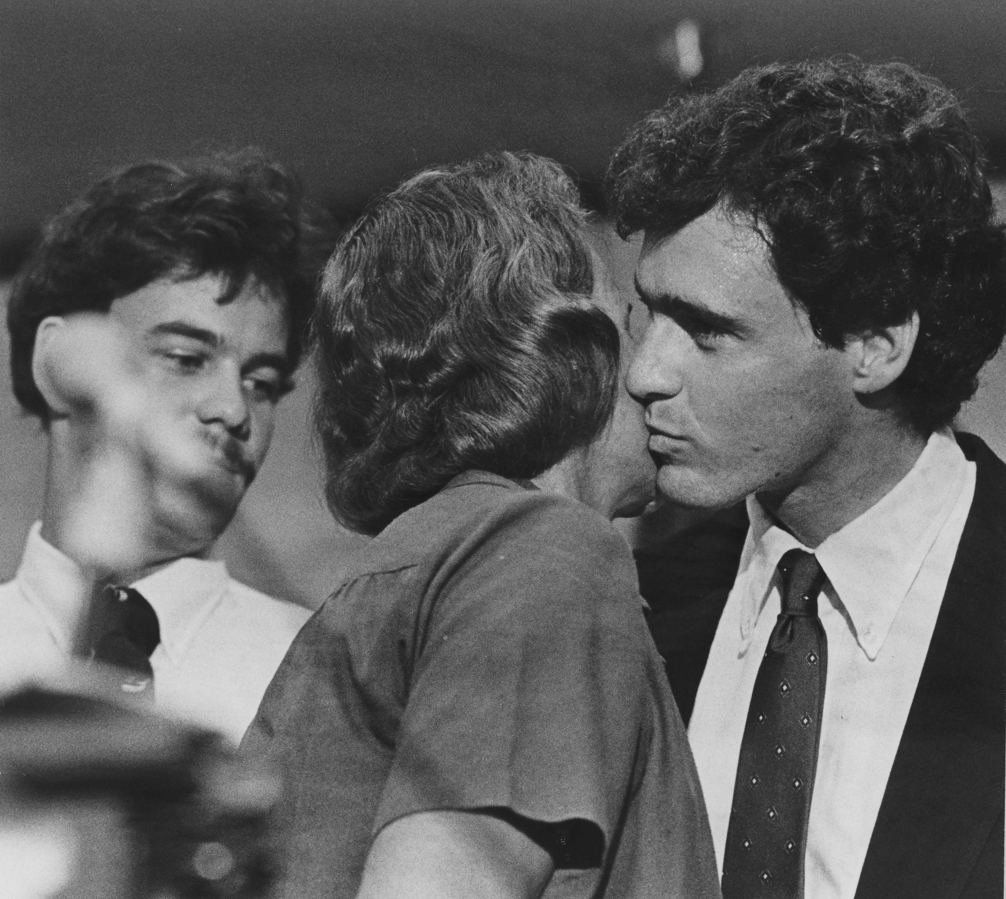 Sandra Day O'Connor, nominated for the U.S. Supreme Court, gets a kiss from one of her three sons, Scott, while another, Brian, looks on. The third, Jay and their father, John Jay O'Connor III, also attended the news conference in Phoenix, which followed President Reagan's announcement in Washington, D.C., in 1981.