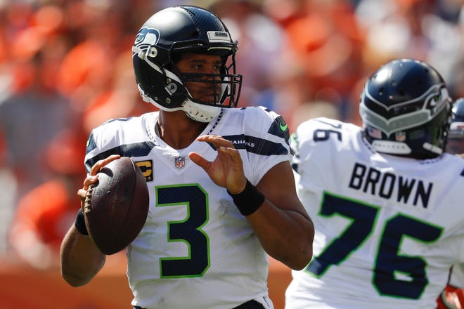Seahawks quarterback Russell Wilson  says he remains focused on the season, despite a Sports Illustrated article alleging a locker room rift in 2017.