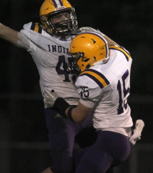 Indianola senior Dylan Hildreth celebrates his touchdown with junior Brayden Wireman. Des Moines Lincoln hosted Indianola for homecoming on Sept. 14.