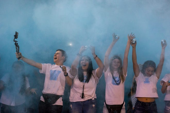 Cactus students throw up blue powder during the game against Salpointe on Friday, Sept. 14, 2018, at Cactus High School in Glendale, Ariz.#azhsfb