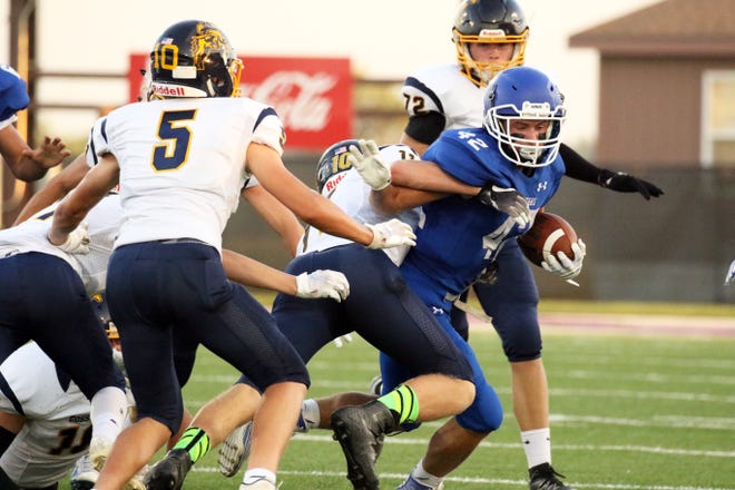 Dawson Mulder of Sioux Falls Christian attempts to elude the tackle by Lane VanderWal of Sioux Valley during Friday night's game in Sioux Falls.