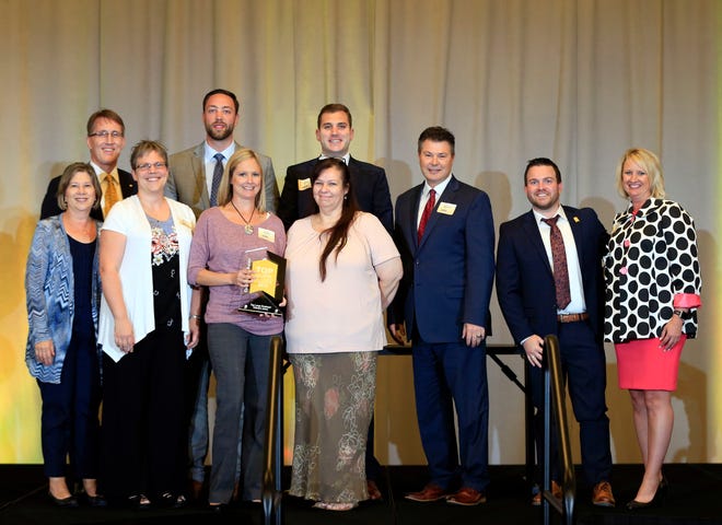 Edward Jones representatives accept the award for top large employer during the Top Workplaces awards in 2018. Edward Jones has participated in Top Workplaces for eight years and has finished in the top ranks each of those years.