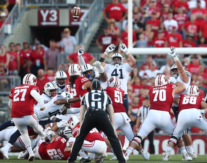 Wisconsin Badgers kicker Rafael Gaglianone (27) misses a 42-yard field goal attempt that would have tied their game against the Brigham Young Cougars on Saturday.