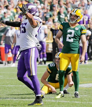 Green Bay Packers kicker Mason Crosby (2) reacts after missing a field goal as Minnesota Vikings linebacker Anthony Barr (55) celebrates in the fourth quarter at Lambeau Field on Sunday, September 16, 2018 in Green Bay, Wis.