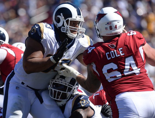 Rams defensive tackle Ndamukong Suh works against Cardinals rookie center Mason Cole during the second half of a game Sunday.