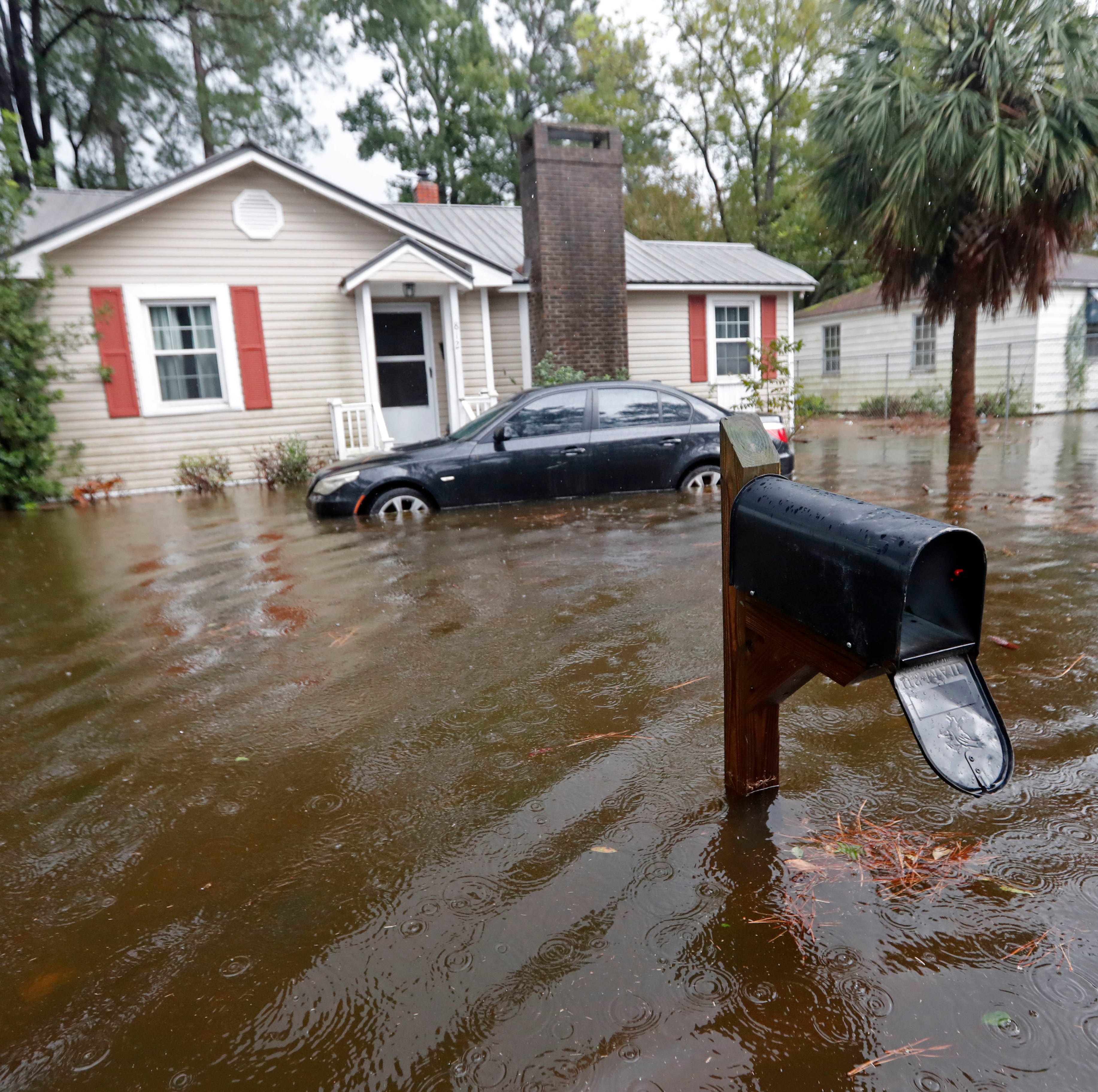 Floodwaters from Hurricane Florence encroach on homes in Marion, S.C., Sunday, Sept. 16, 2018.