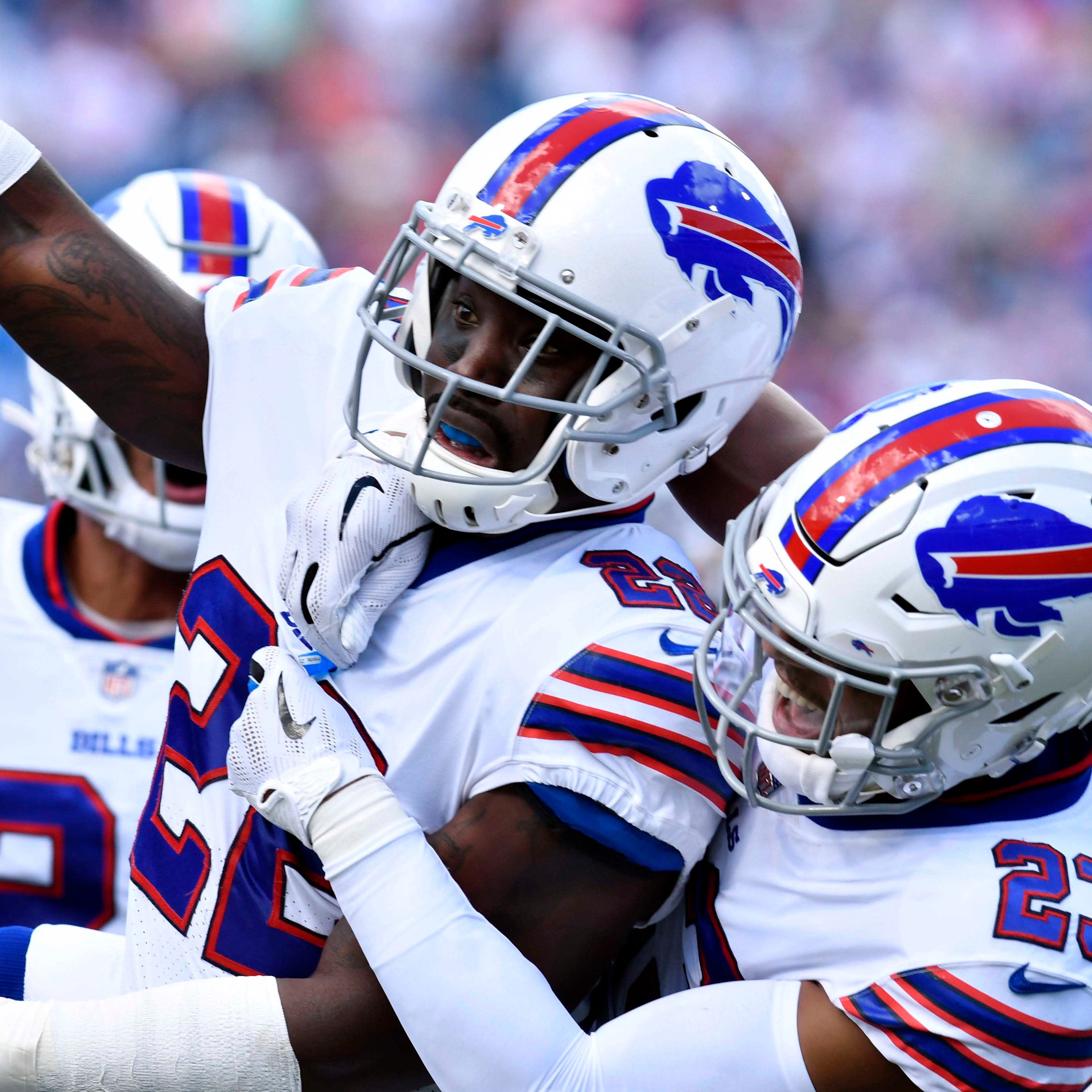 Bills defensive back Vontae Davis, center, celebrates making a third-down stop in the first quarter of Sunday's game vs. the Chargers.