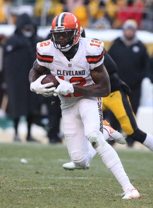 Cleveland Browns wide receiver Josh Gordon (12) runs after a catch against the Pittsburgh Steelers during the fourth quarter at Heinz Field.