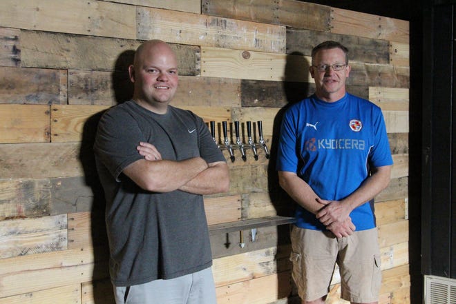 Joe VanBuskirk, left, and Tim Chambers, right, look to continue growing their brewing operation in Marion as COVID-19 mandates are lessened and lifted in the state.