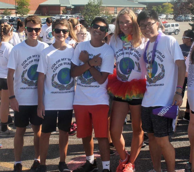 Northville High School junior Annie Heitmeier (second from right) orchestrated a color run to help raise awareness for teenage depression.