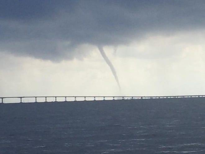 This waterspout loomed on the horizon during a fishing trip with Krista Miller of Island Charters. “They were coming down 3 and 4 at a time,” she said. “Lightning was close by, so I didn’t wanna stop, but my client, Edward Tinsley, snapped the photo.”