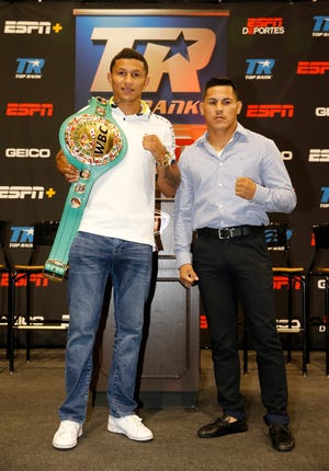 WBC Super featherweight champion Miguel Berchelt and challenger Miguel Roman stand together at the end of the press conference announcing their upcoming title fight in the Don Haskins Center on November 3.