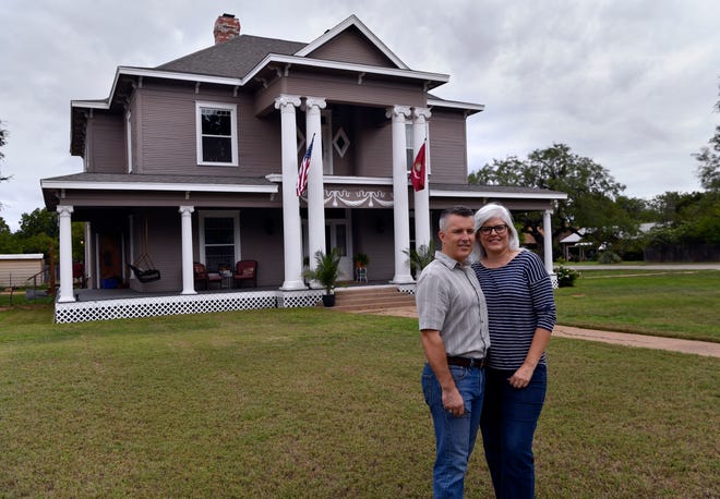 Jim and Dana Willeford in front of their historic 1903 home at N. 3rd and Clinton streets on Sept. 15. Known locally as Rosetyme, the Willefords are renaming their house The Resilient.