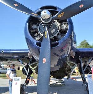 Richard Faccio of Norway, Michigan, checks out the TBM Avenger, a WWII plane, at the at the Oconto Fly-in, Car & Tractor Show last Septmber at the Oconto-J. Douglas Bake Municipal Airport. This year's show is Sept. 21.
