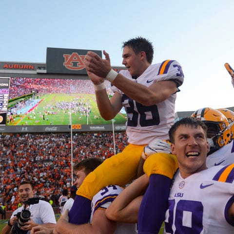 Cole Tracy celebrates after kicking the...