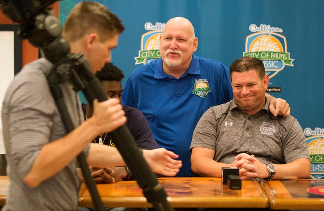 City of Palms Classic's Donnie Wilkie, center, welcomes Lehigh Senior High School basketball coach Greg Coleman, right, to the annual basketball tournament during a press conference on Wednesday at the Crowne Plaza Fort Myers at Bell Tower Shops in south Fort Myers. The tournament begins Dec. 17.