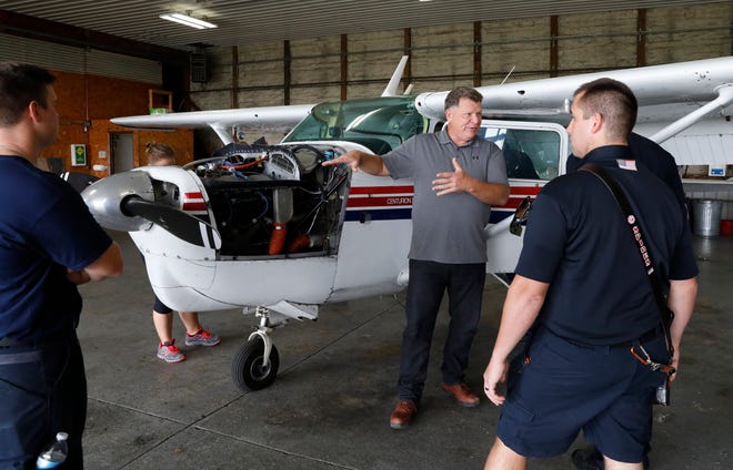 Mark Harden, program manager for the Federal Aviation Administration Safety Team, talks to Greenfield Township firefighters about the hazards of attempting rescues from an airplane Wednesday, Sept. 19, 2018, at the Fairfield County Airport in Lancaster.