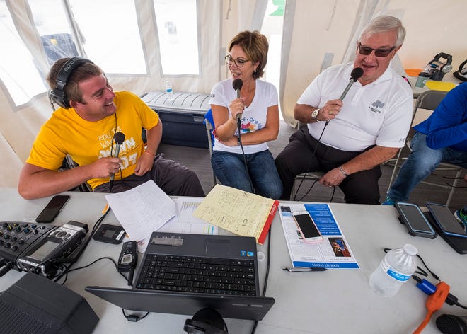 Paul Maxwell, right, speaks on the radio with St. Clair County CMH director Deb Johnson, center, and Q Country 107 WSAQ host Matt Markham Wednesday, Sept. 19, 2018, during the Community Roof-Sit for Kids' Rooftop Rally.
