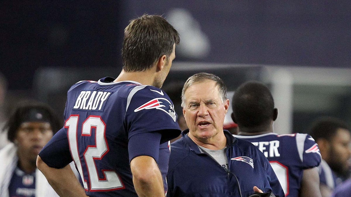 Patriots head coach Bill Belichick talks with quarterback Tom Brady during the fourth quarter against the Philadelphia Eagles at Gillette Stadium during the preseason.