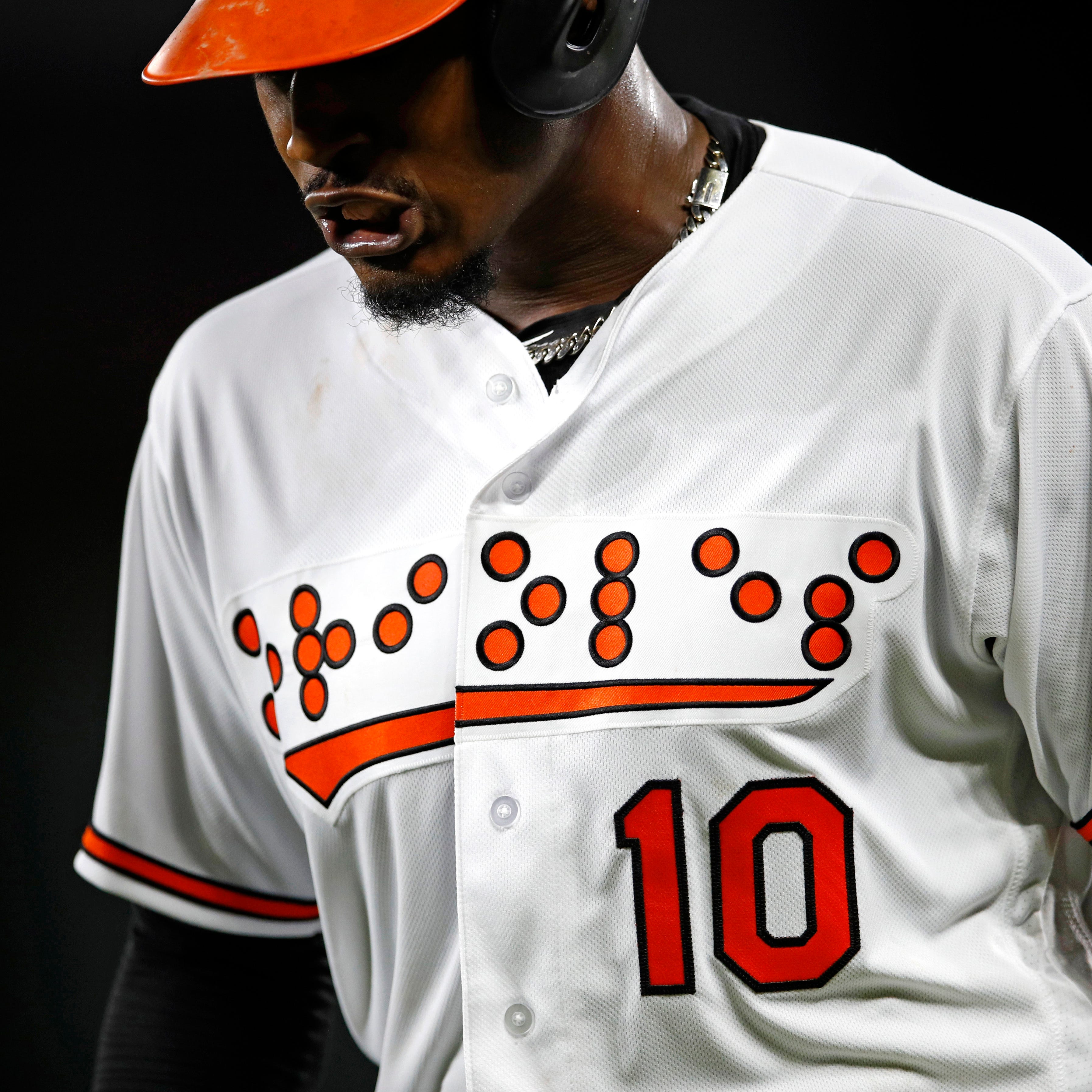 Baltimore Orioles outfielder Adam Jones wears a jersey that reads 