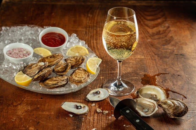 Oysters and a glass of wine make for a classic pairing.