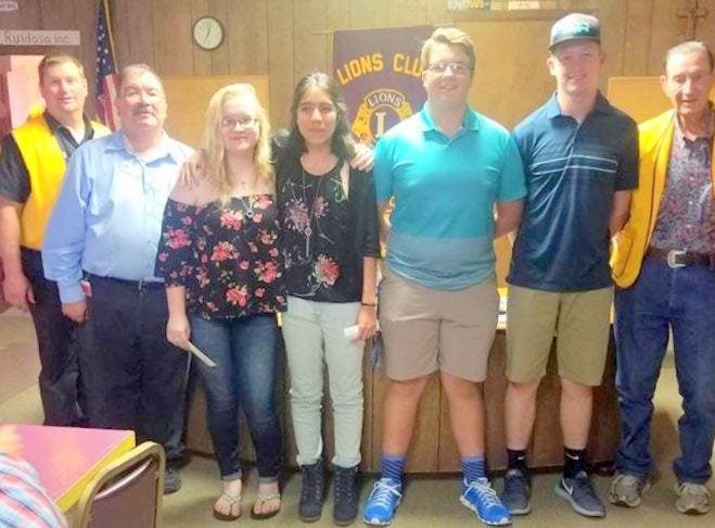 Scholarship recipients are flanked by Ruidoso Evening Lions Club members, from left, Brad Stewart, Alfred Romero, Micala Applin, Valeria Hernandez, Joshua Mader, Brennam Stewart and President Ray Courtney.