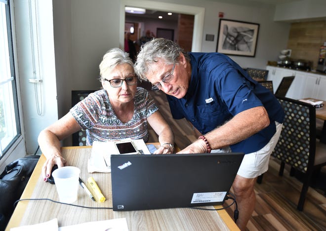 Richard Knight (right), a resident at Castaway Cove neighborhood in Vero Beach, views his residence on a map as Patty Rawlings, of Arcadis, a consultancy firm from Orlando, helps comfort displaced residents like Knight as the U.S. Army Corp of Engineers searches somewhere in Knight's neighborhood for the remains of WW II-era munitions, on Thursday, Sept. 20, 2018, in Vero Beach. "They can come spend the day at the hotel," Rawlings said. "They can use the facilities, use the pool, we have lunch scheduled for them, and we just try to make it as easy as an experience as possible." Knight is one of about 25 residents temporarily staying inside the Country Inn & Suites lobby by the Outlet Mall at I-95, who have been asked to evacuate their homes as the Corps continues to search for possible munitions left behind from training exercises during the war. "It's a little bit nerve racking, but I hope they don't find anything," Knight said.
