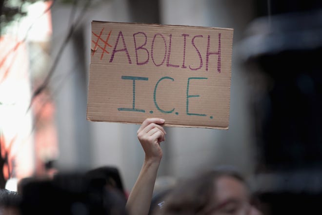 Demonstrators march through downtown Chicago calling for the abolition of the U.S. Immigration and Customs Enforcement (ICE) on August 16, 2018.