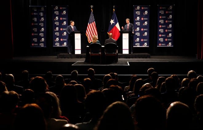 Republican U.S. Sen. Ted Cruz, left, and Democratic U.S. Rep. Beto O'Rourke take part in their first debate for a Texas U.S. Senate seat in Dallas on Sept. 21, 2018.