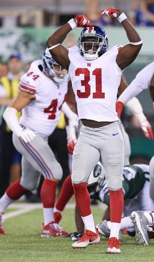 Aug 24, 2018; East Rutherford, NJ, USA; New York Giants co-captain and defensive back Mike Thomas (31) celebrates during the second half against the New York Jets at MetLife Stadium.