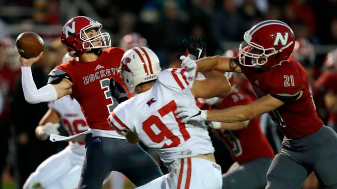 Logan Wilson of Kimberly tries to get by Carson Hughes of Neenah to get to Sam Dietrich on Friday at Rocket Stadium in Neenah.
Ron Page/USA TODAY NETWORK-Wisconsin