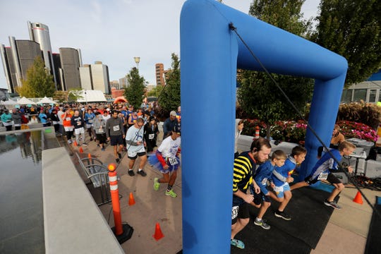 Participants cross the starting line at the 2018 Detroit Undy RunWalk on the Detroit Riverwalk on Saturday, Sept. 22, 2018. 