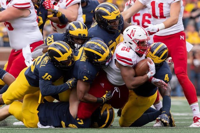 Nebraska running back Devine Ozigbo is tackled by the Michigan defense in the fourth quarter.